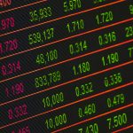 Home Close-up of a digital stock market data display showing colorful financial numbers and trends.